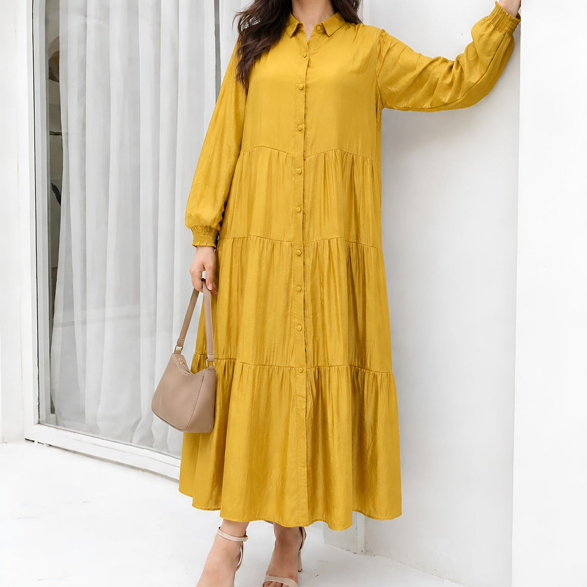 Back view of floor-length tiered maxi dress with relaxed sleeves