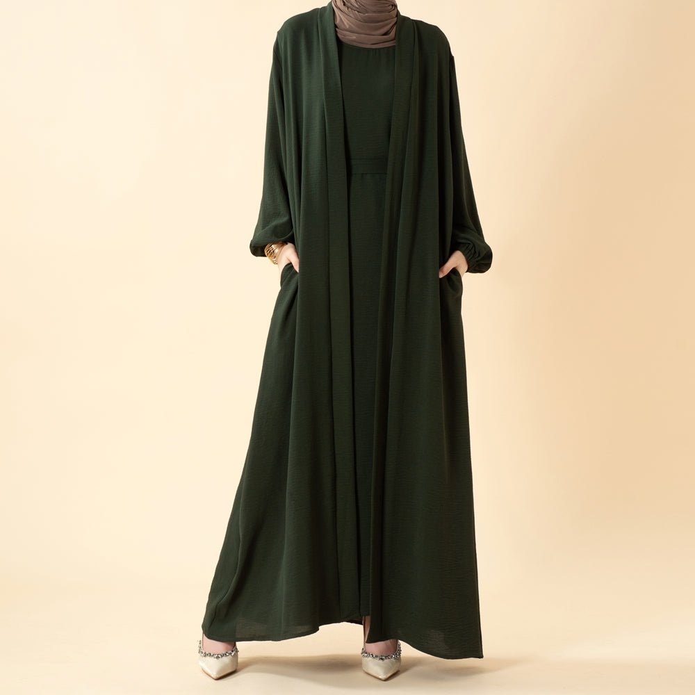 Full-length front view of the open abaya set with pockets and belt