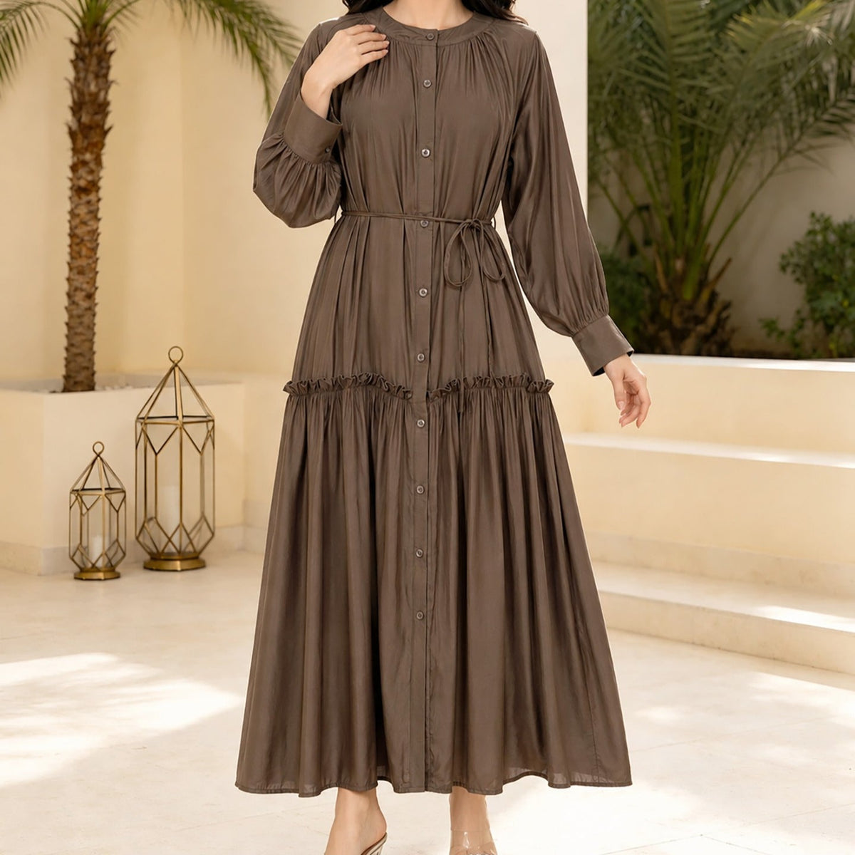 Back view of solid colour tie-waist maxi abaya showing flared skirt