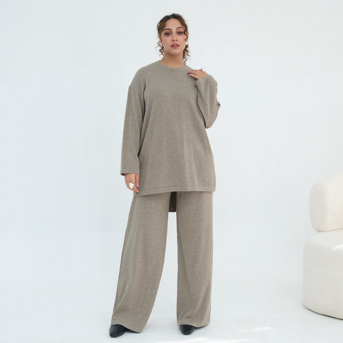 Detail of long-sleeve cuff on cropped knit top