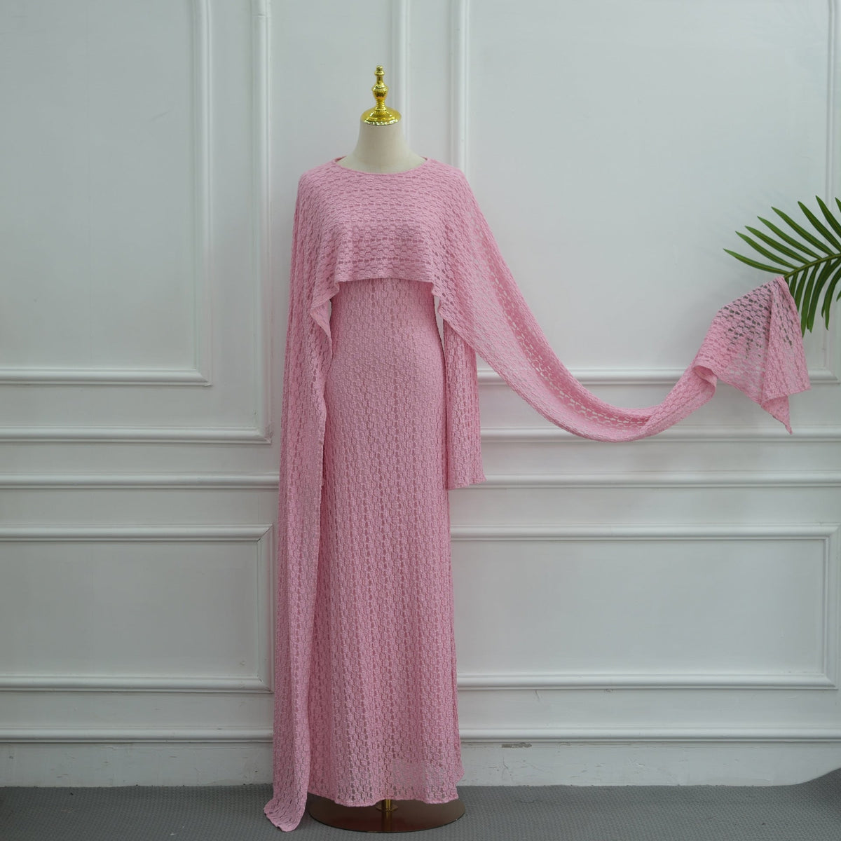 Lace self-tie belt threading through sides of the dress