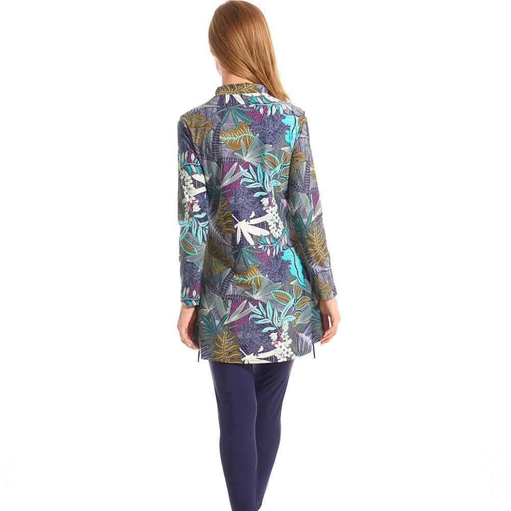 Close-up of tropical palm leaf print on high-neck ruffled burkini swim top