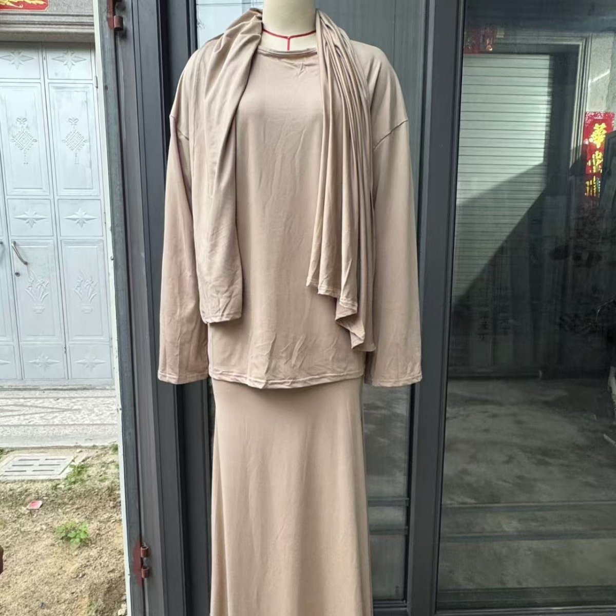 Coordinated two-piece set with attached hijab in classic black
