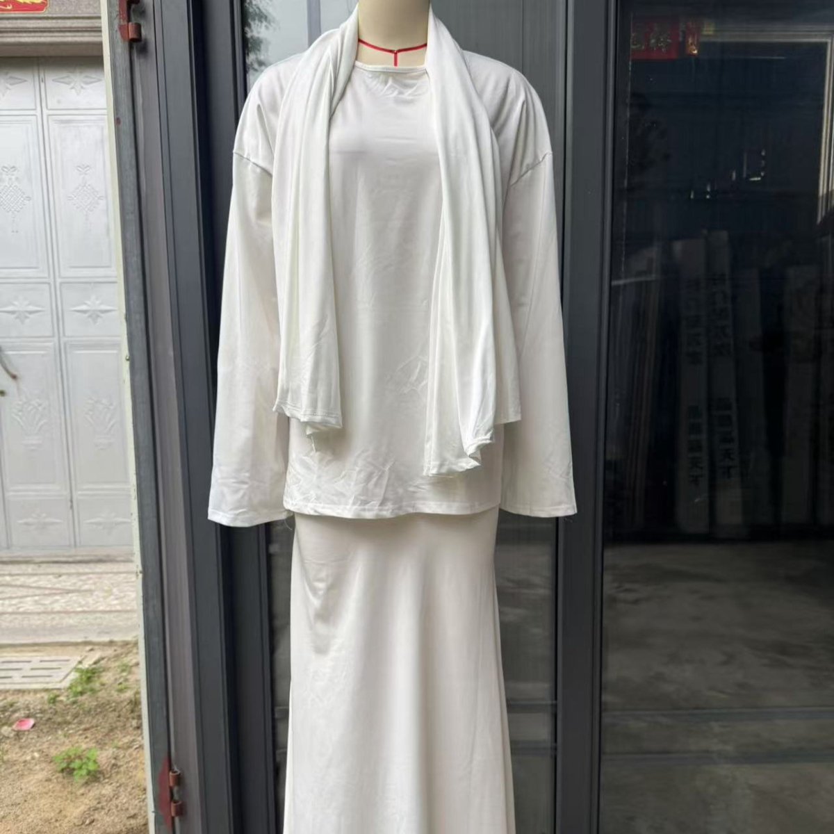 Modest black ensemble with convenient integrated head covering