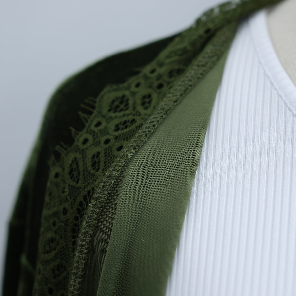 Velvet-look abaya layered over inner dress for a monochrome modest look