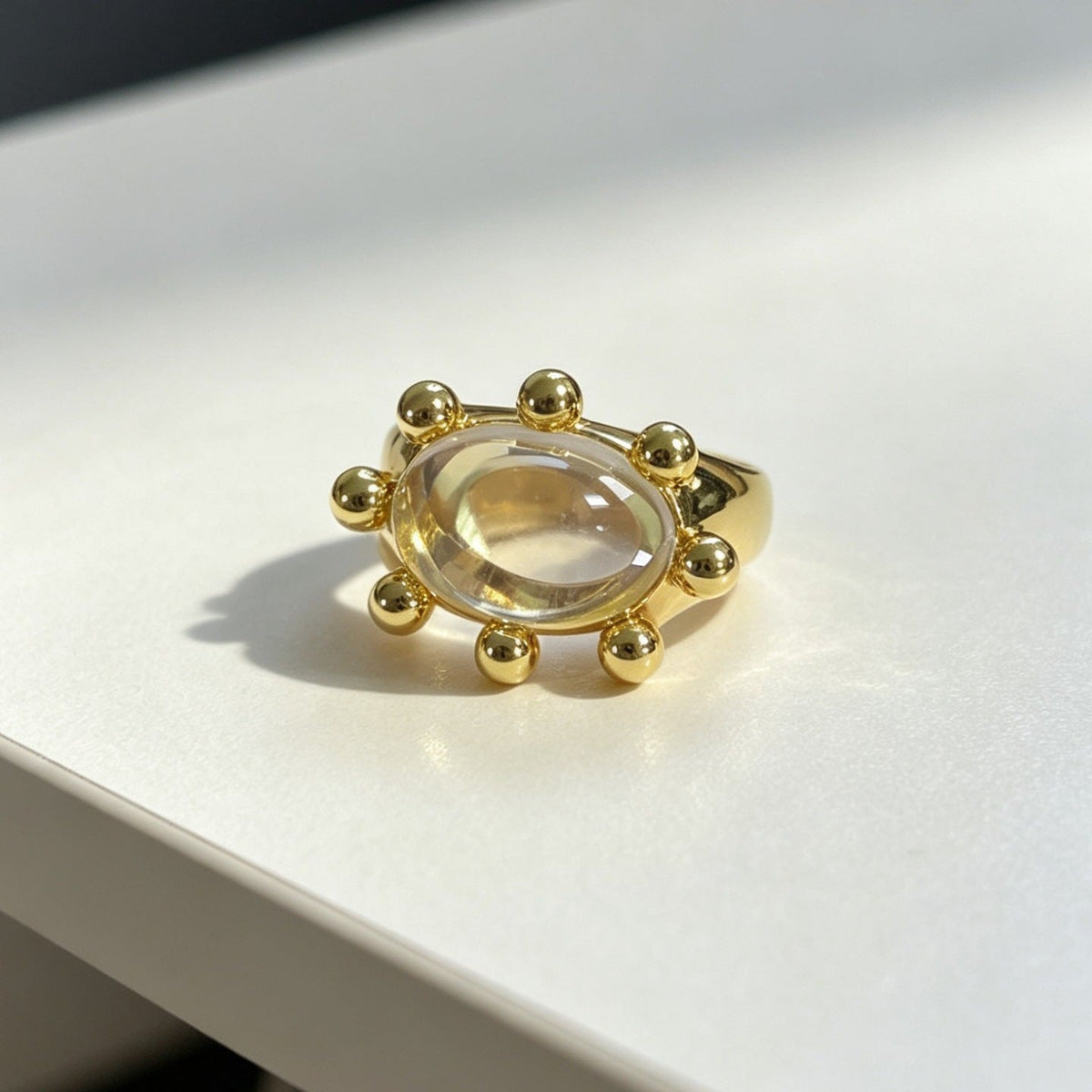 Detail shot of beaded sunburst border catching light on the adjustable ring
