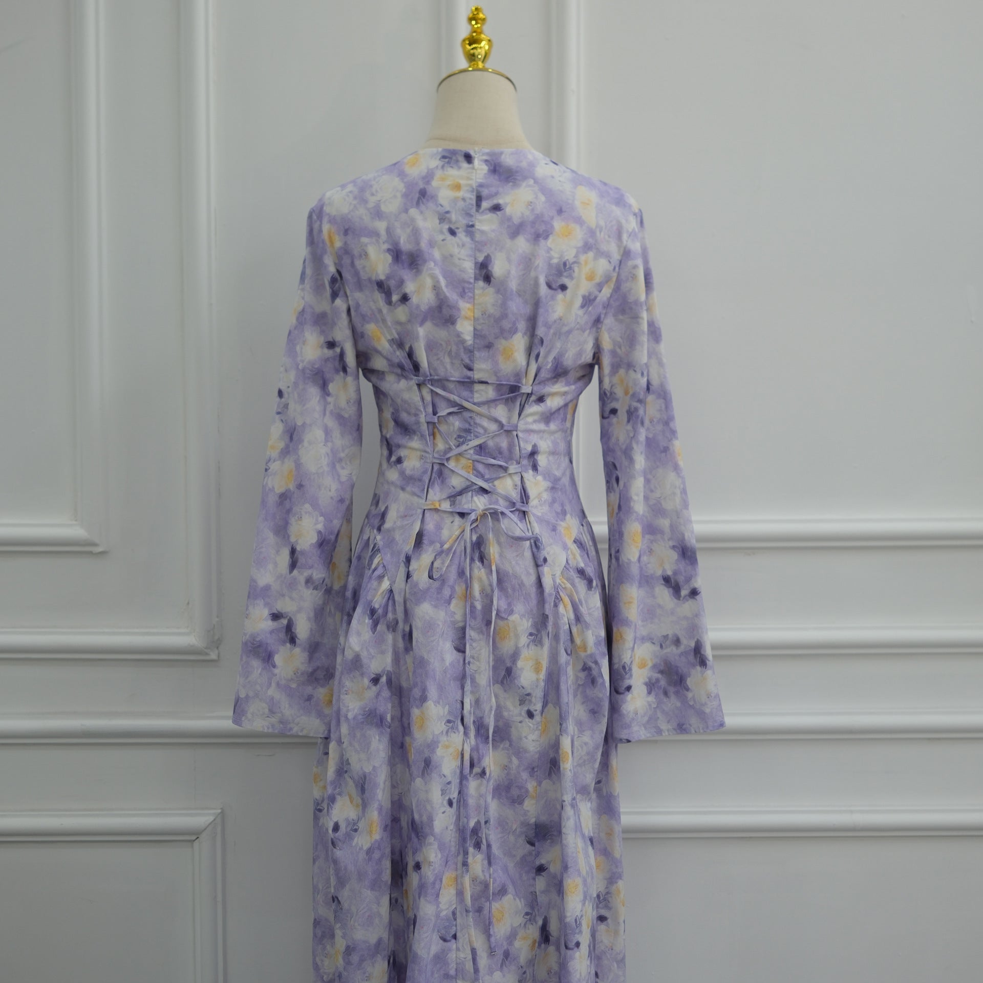 Round neckline close-up on modest watercolour floral print dress