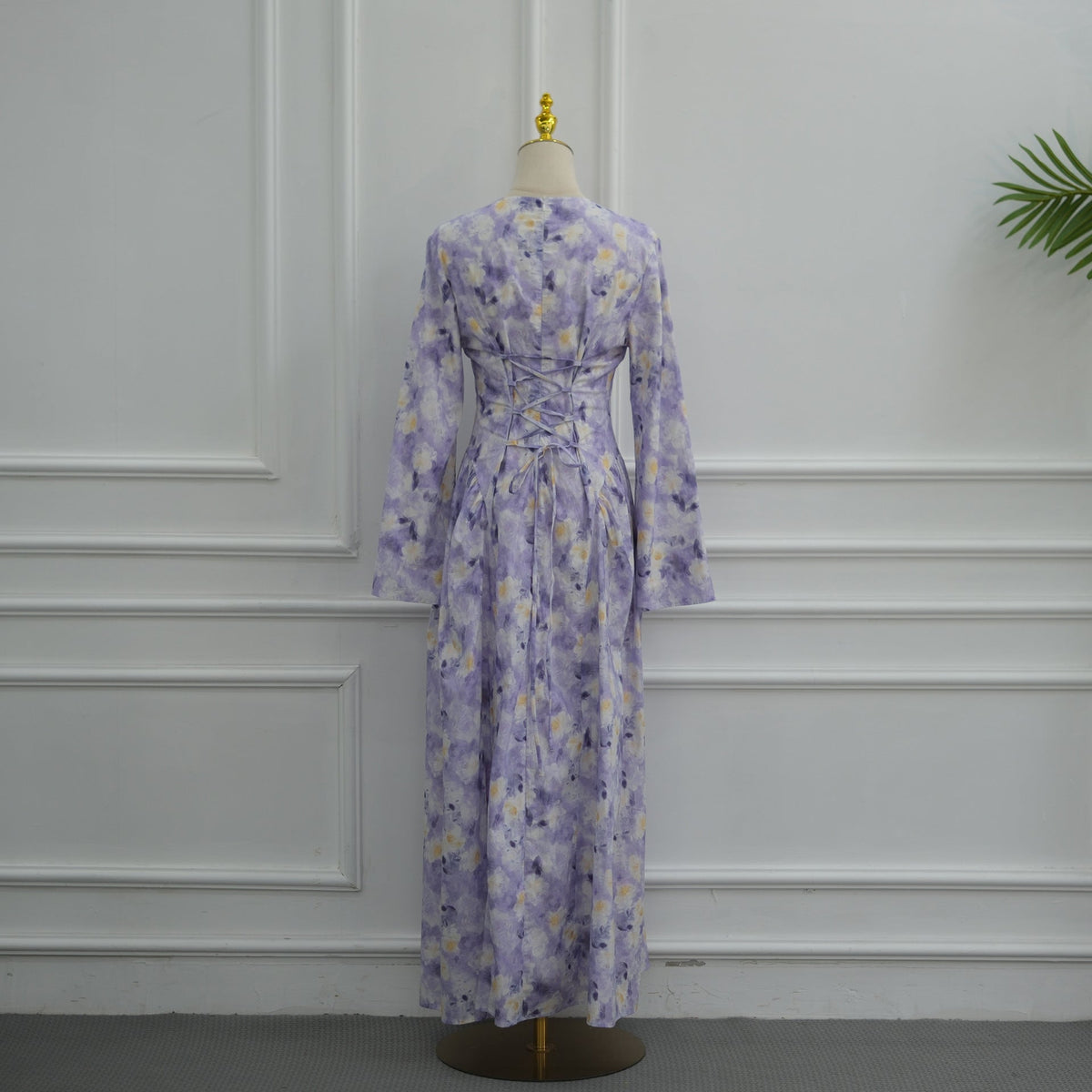 Concealed back zip detail above lace-up corset on floral maxi dress