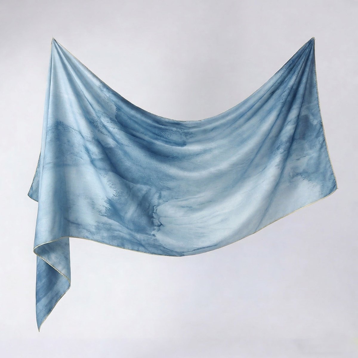 Oversized printed hijab shawl styled over abaya for formal occasion