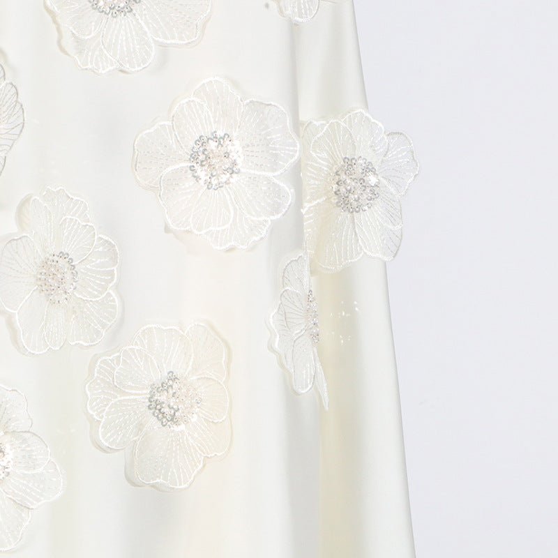 High mock neckline detail of the bridal appliqué dress