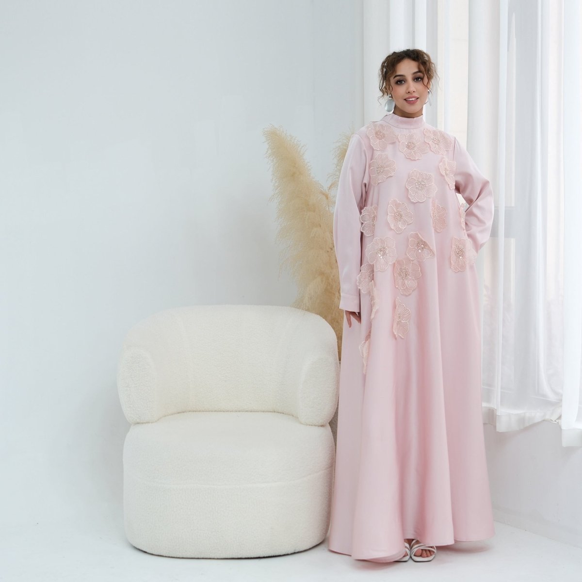 Single-button cuff detail on long fitted sleeve of beaded maxi dress