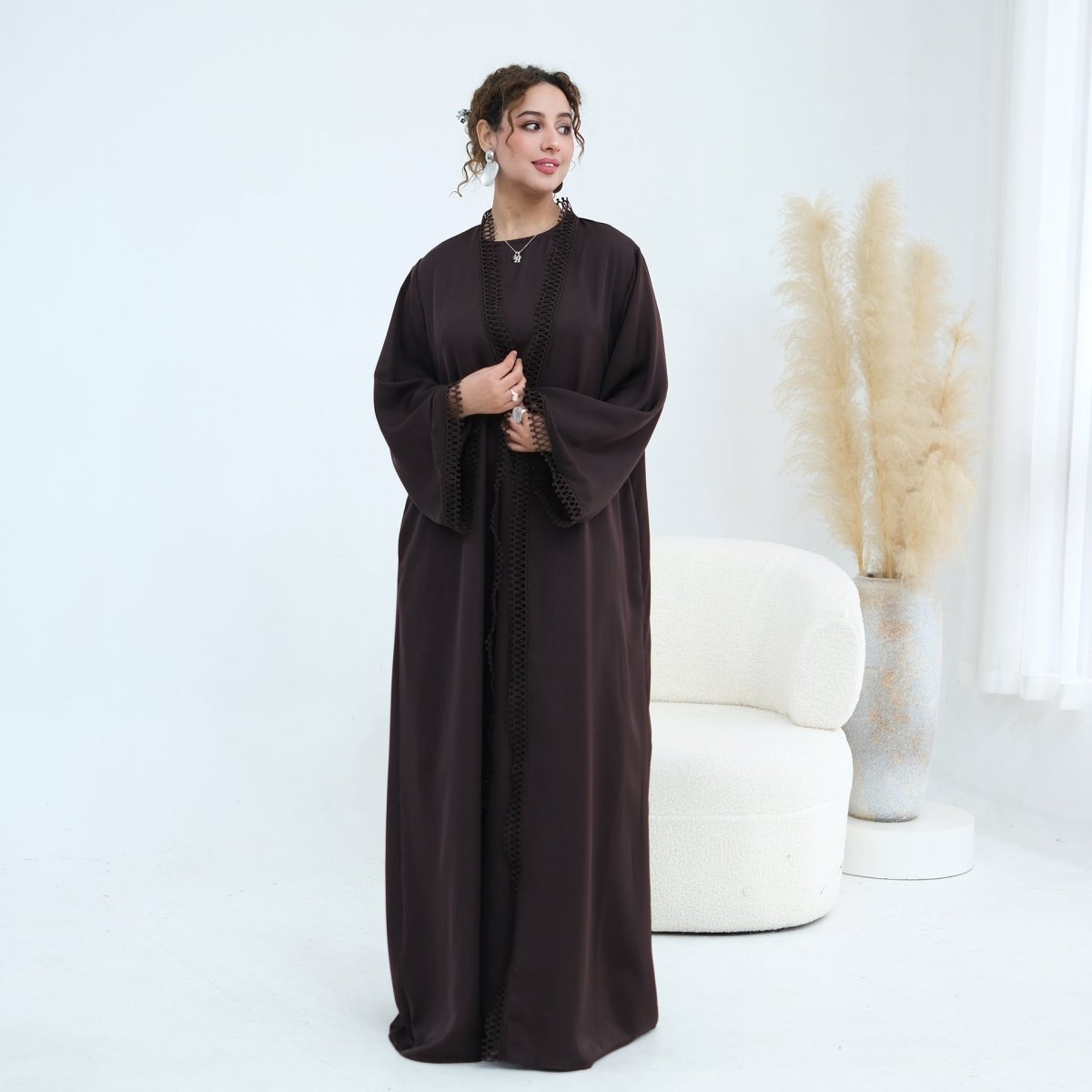 Relaxed batwing sleeve width shown with arms raised