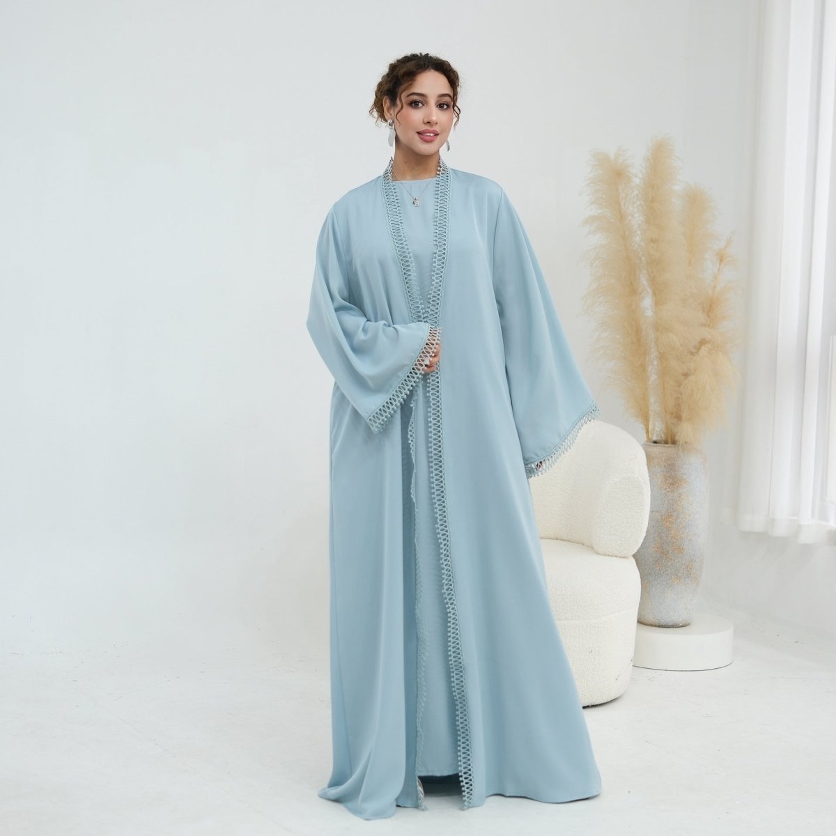 Full-length front view of sleeveless inner dress worn alone
