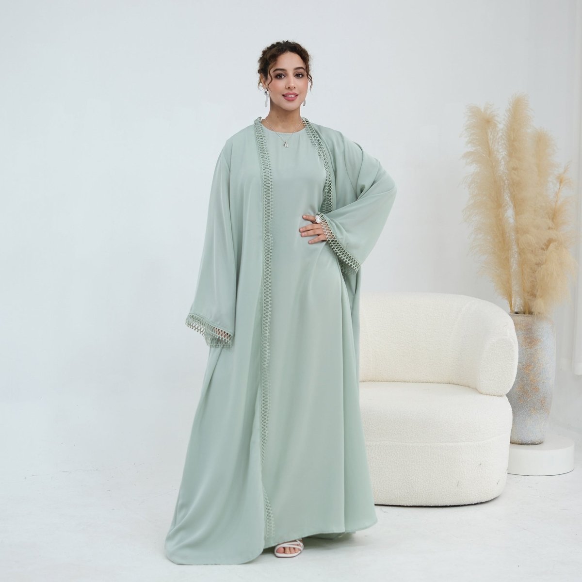 Gold-silver woven lace trim running full length of abaya front panel