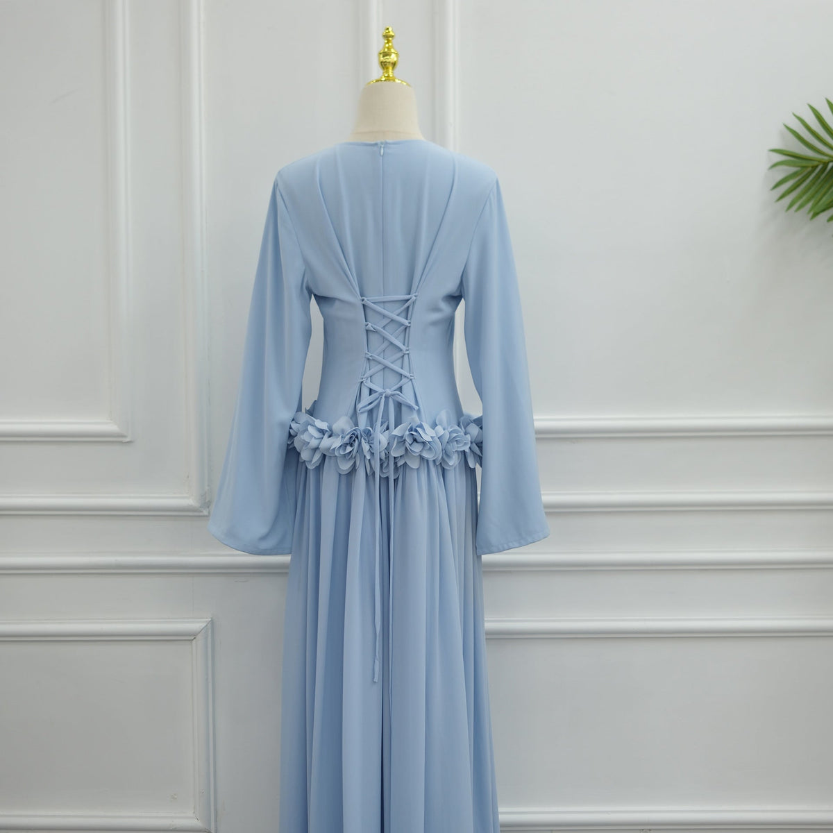 Round neckline and princess-line seam detail on fitted maxi dress