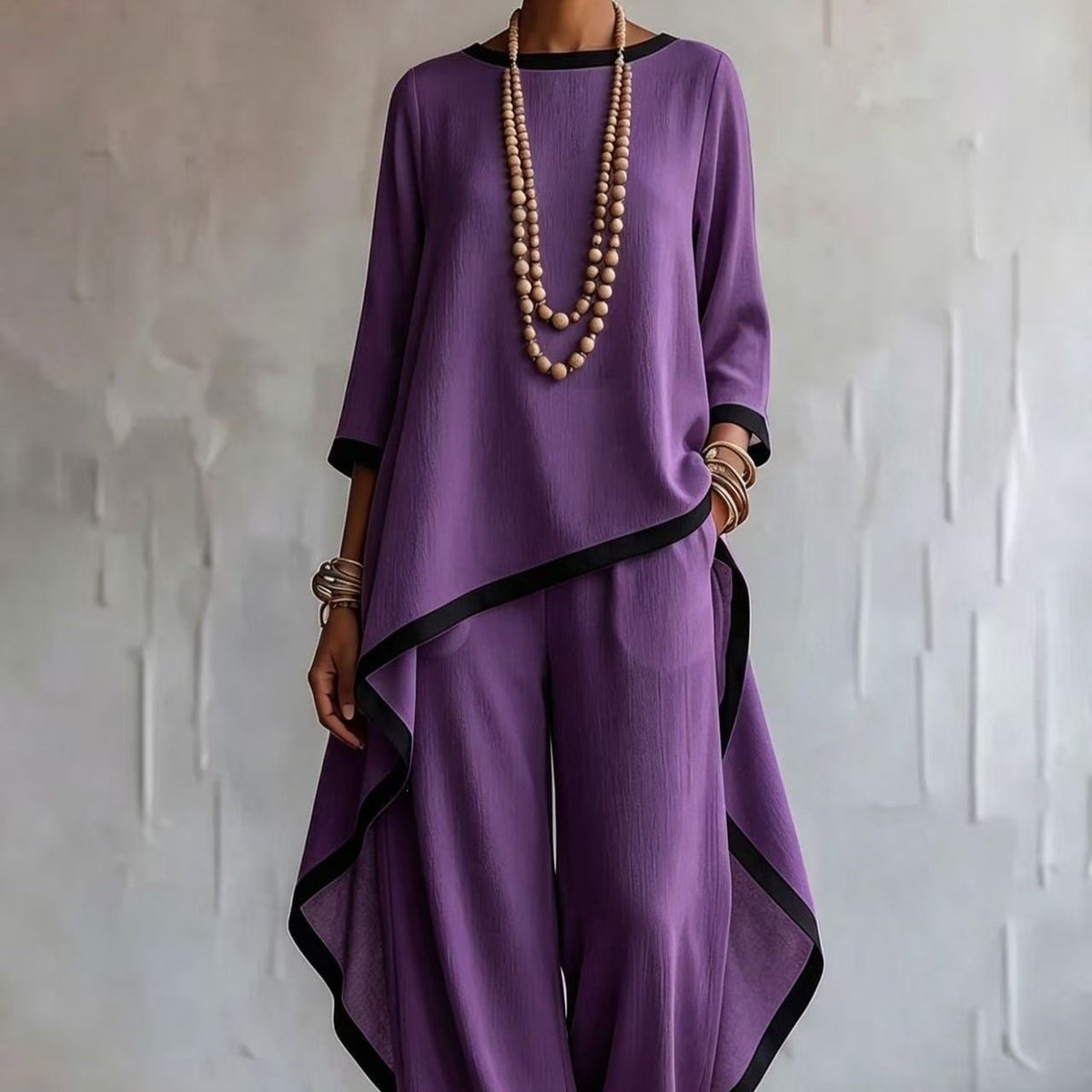 Asymmetric curved hem detail of batwing co-ord top