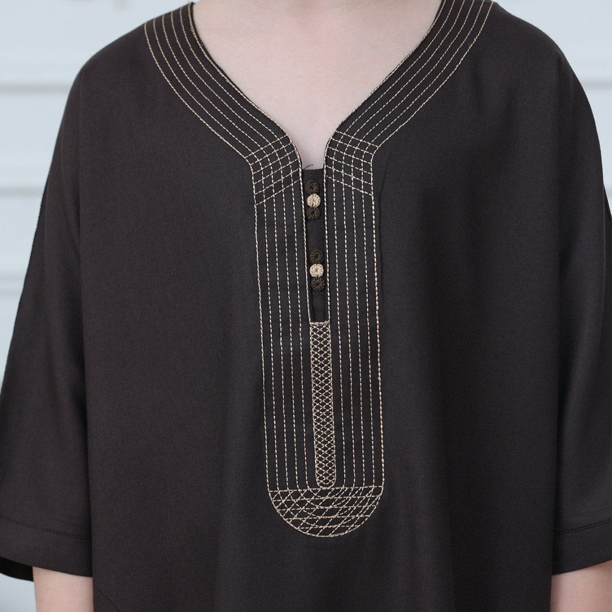 Back view of ankle-length kids thobe with relaxed straight cut