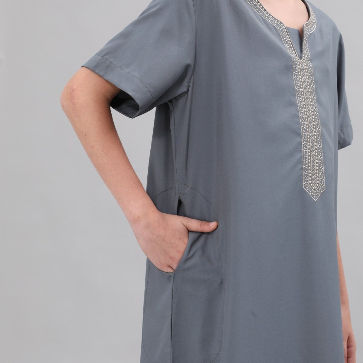 Close-up of side seam pocket on boys' poly-cotton thobe