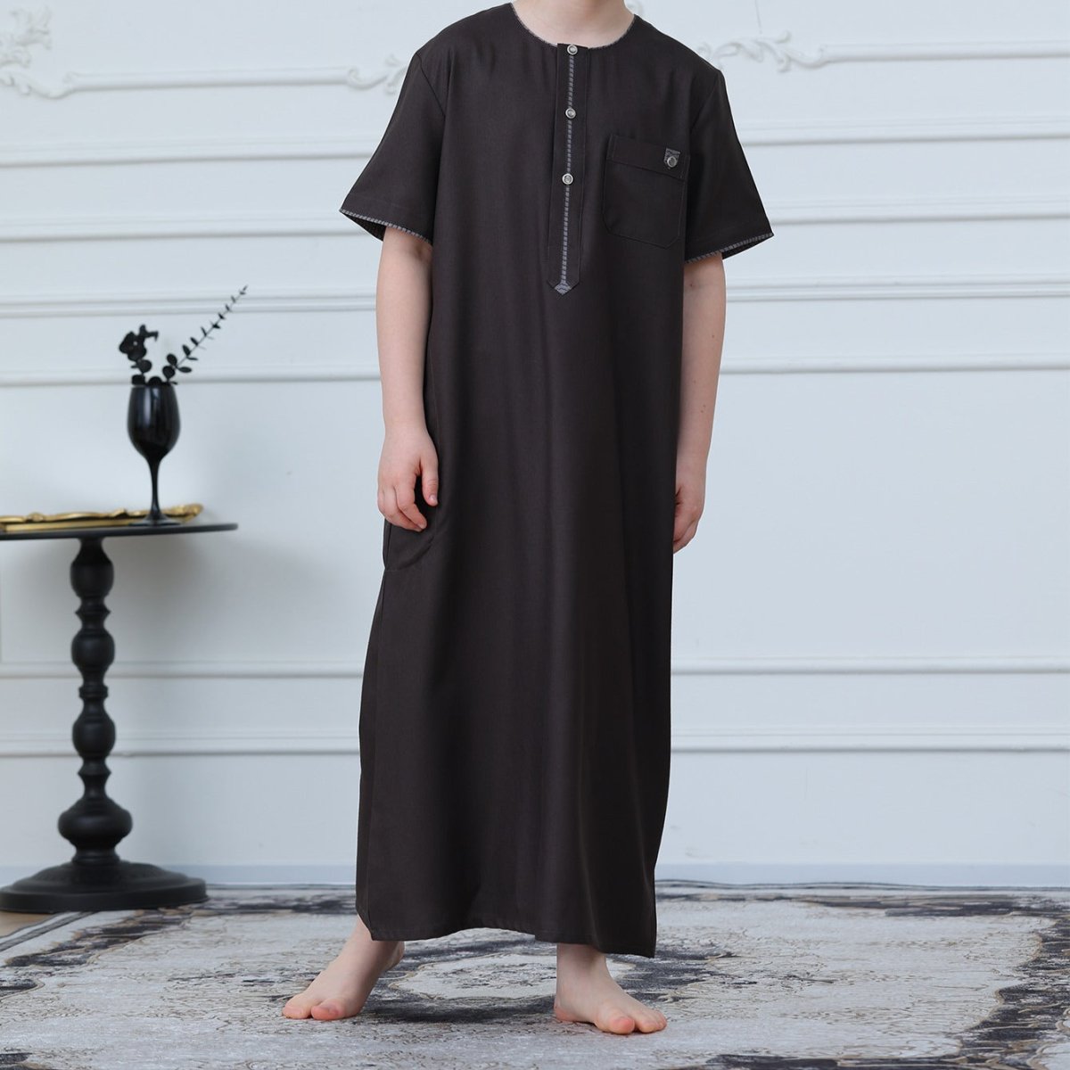 Silver snap button placket detail on chocolate brown kids thobe