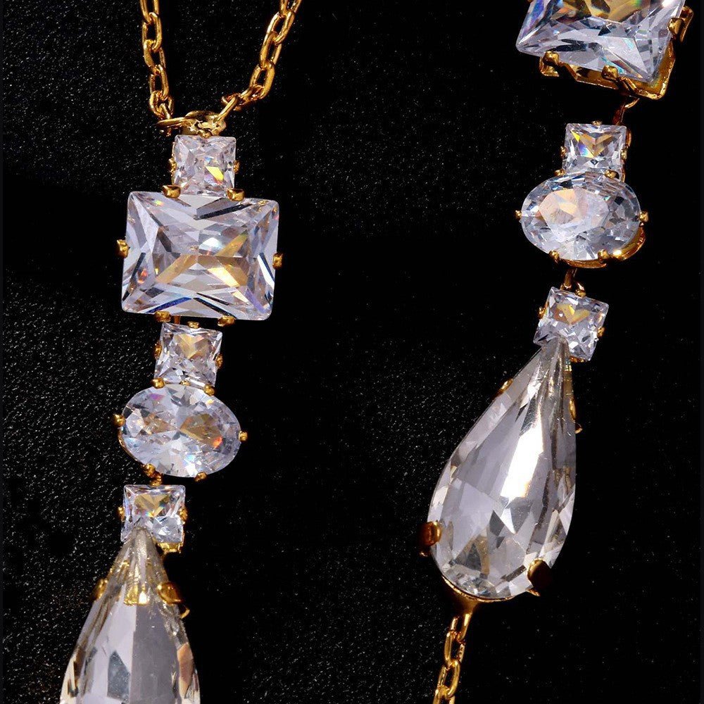 Close-up of sparkling geometric stations on gold backdrop body chain
