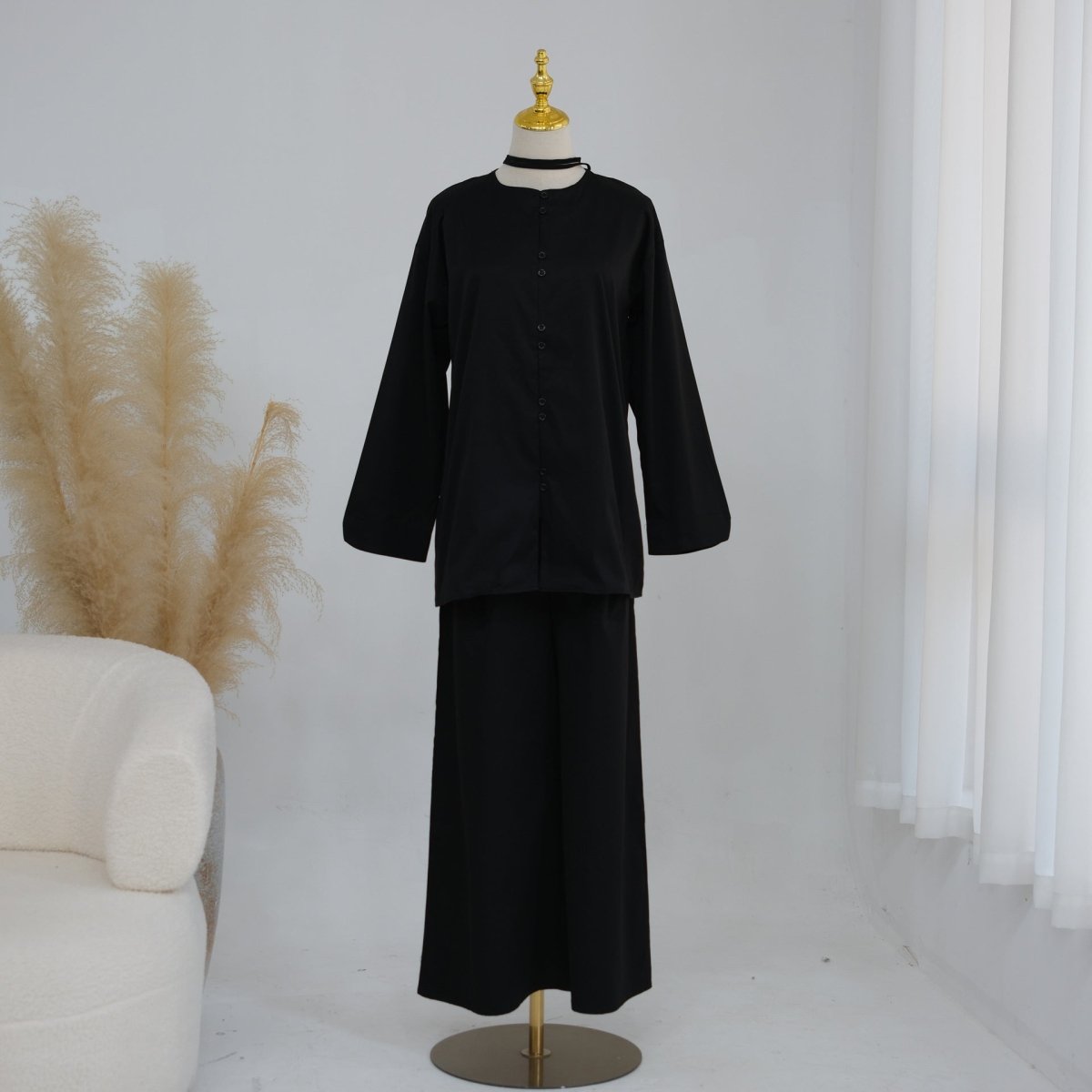 Full back view of button-front longline top with self-tie cord detail