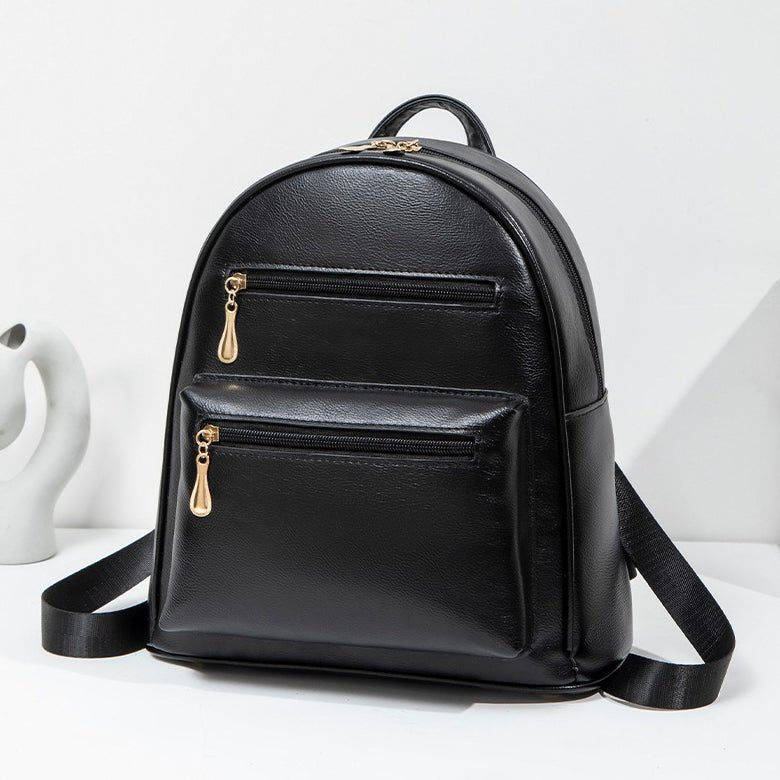 Front view showing zippered front pockets of the casual city backpack