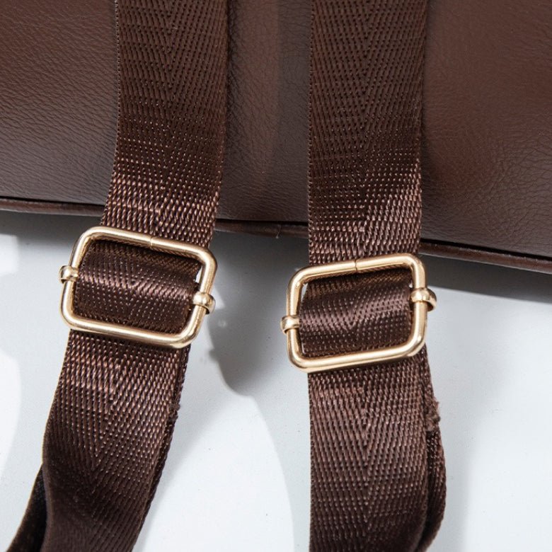 Backpack shown flat to illustrate compact 26x13x27cm dimensions