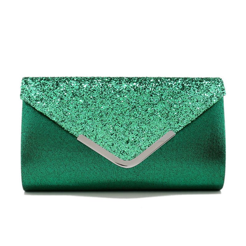 Crossbody clutch bag worn over the shoulder with chain strap