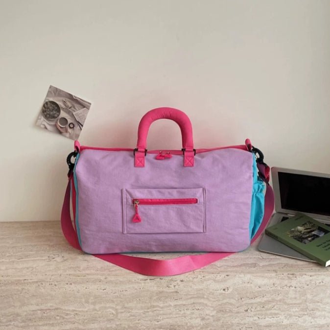 Top handle grip detail on lightweight carry-on duffel bag