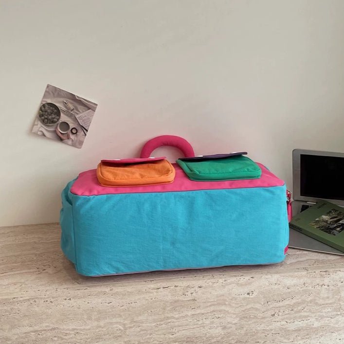 Colorblock travel duffel bag laid flat showing full dimensions