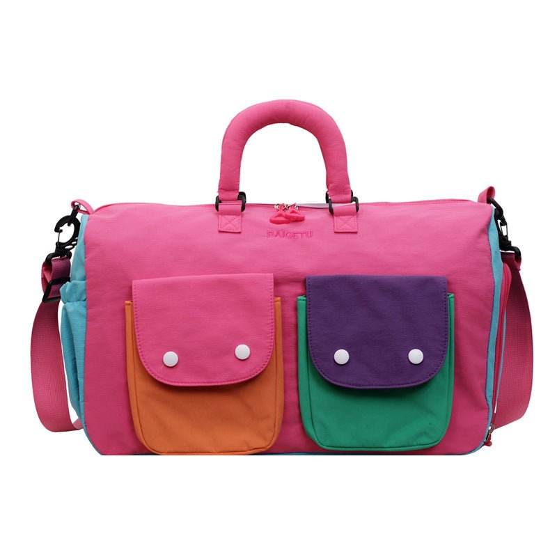 Colorblock duffel bag packed for an overnight trip — capacity view