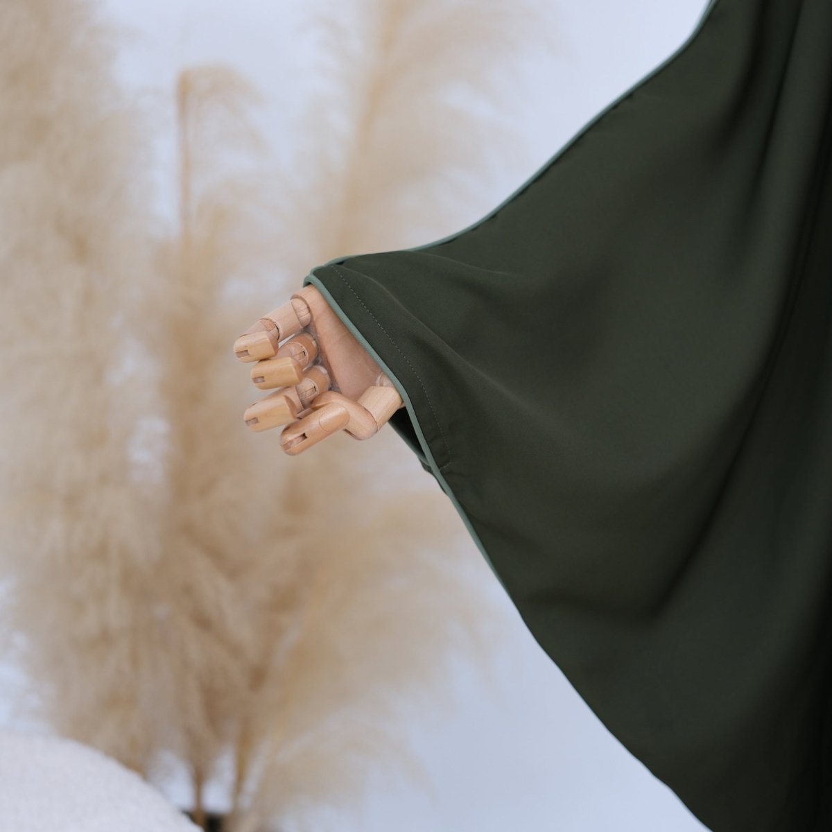 Side profile of batwing abaya highlighting generous relaxed silhouette