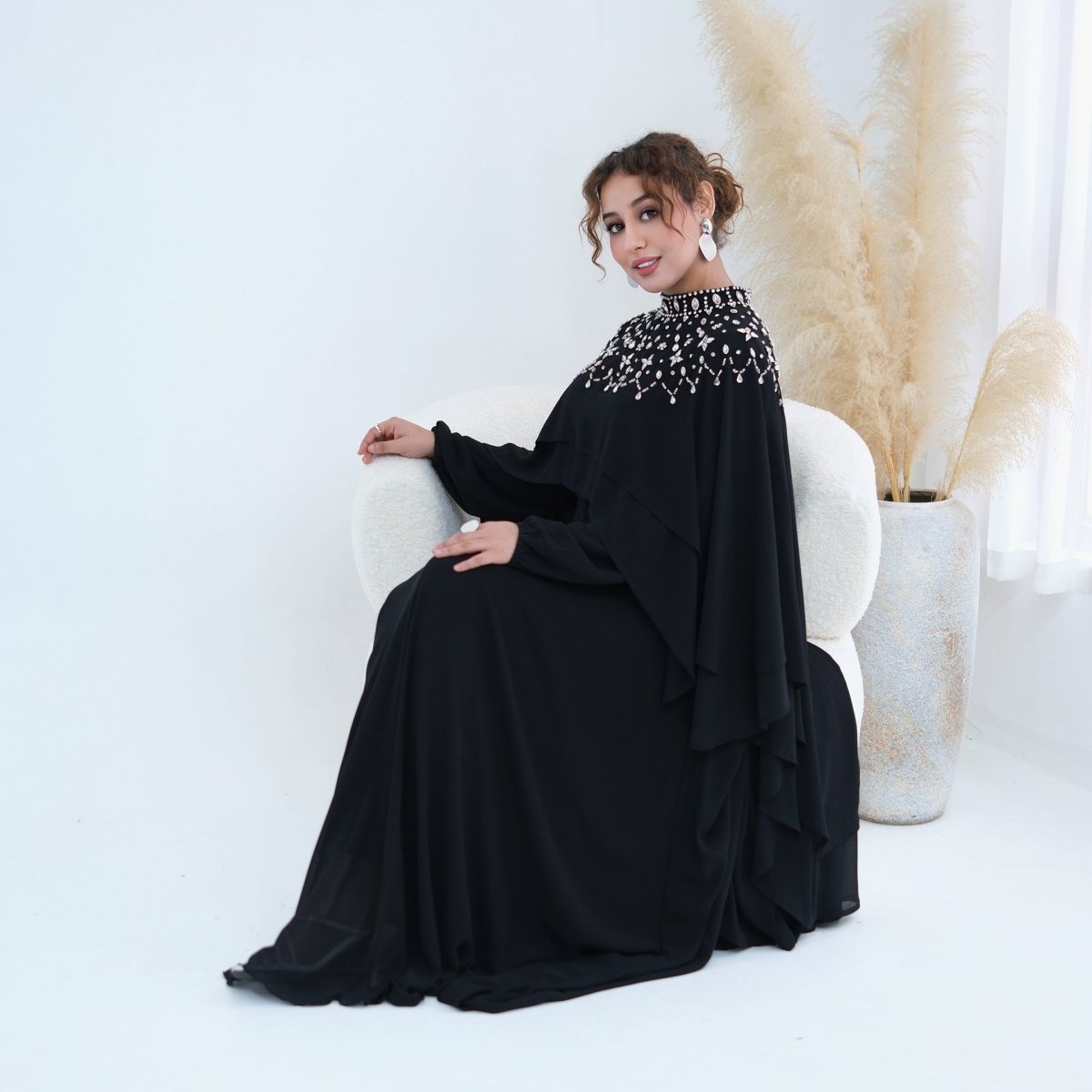 Close-up of round neckline on inner maxi dress with long fitted sleeves
