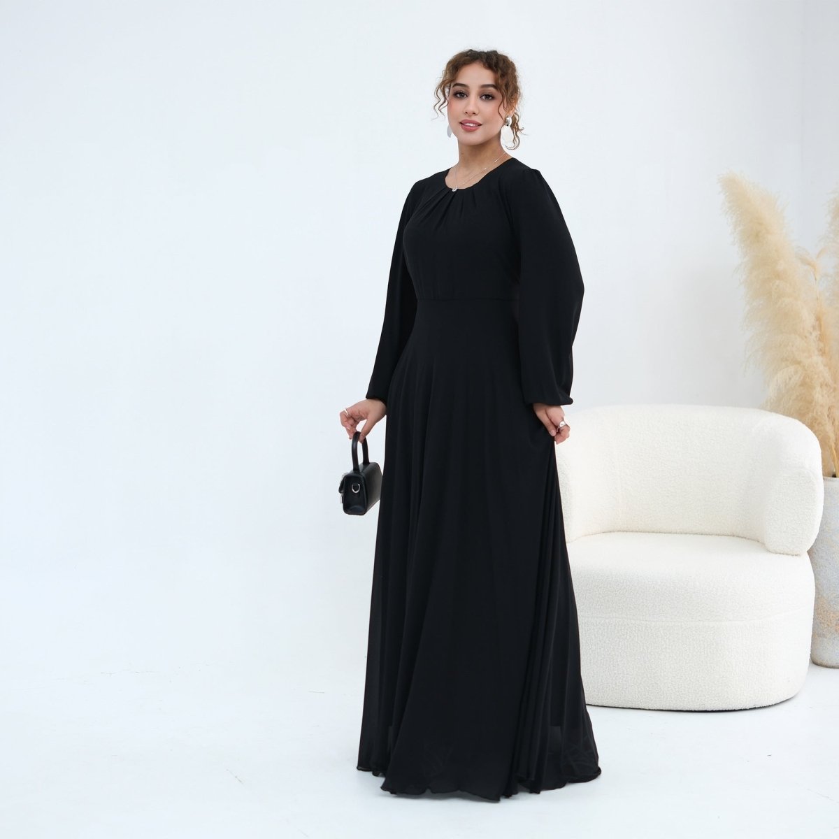 Floor-length hem of relaxed A-line inner maxi dress in chiffon