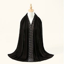 Gradient rhinestone density detail — stones densest at edge, thinning inward across the hijab