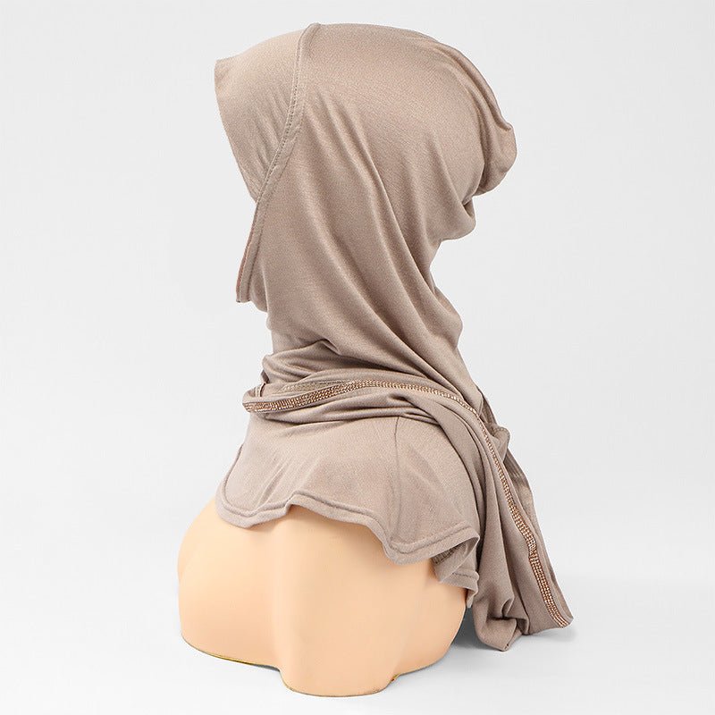 Crystal trim reflecting light on the hijab face frame