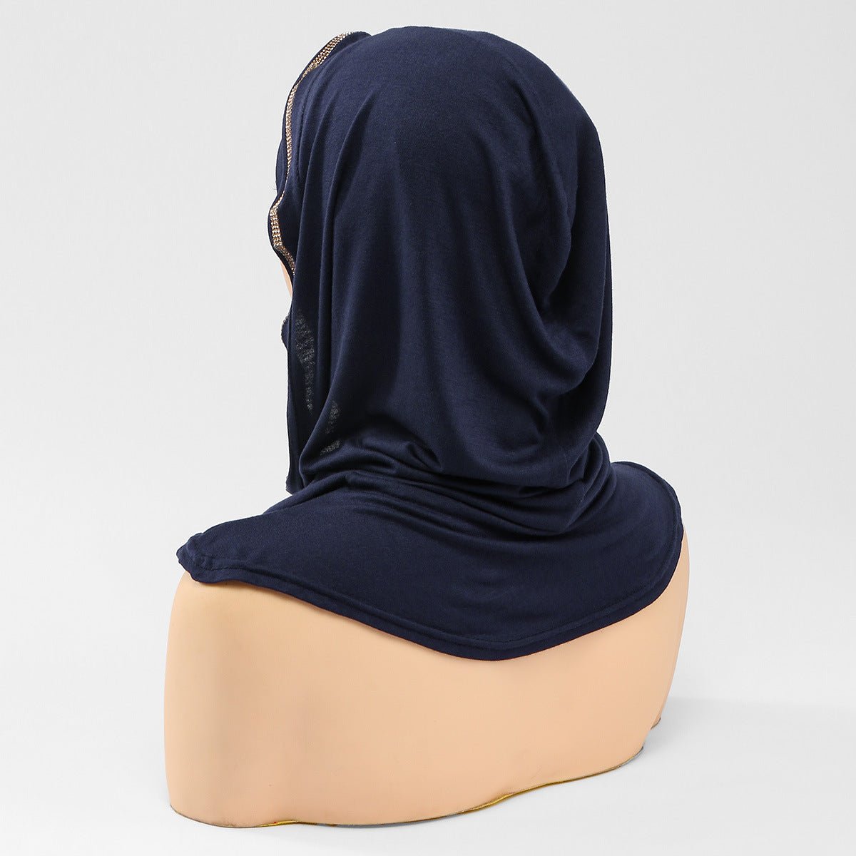 Three-quarter view of instant hijab cap in warm camel tone