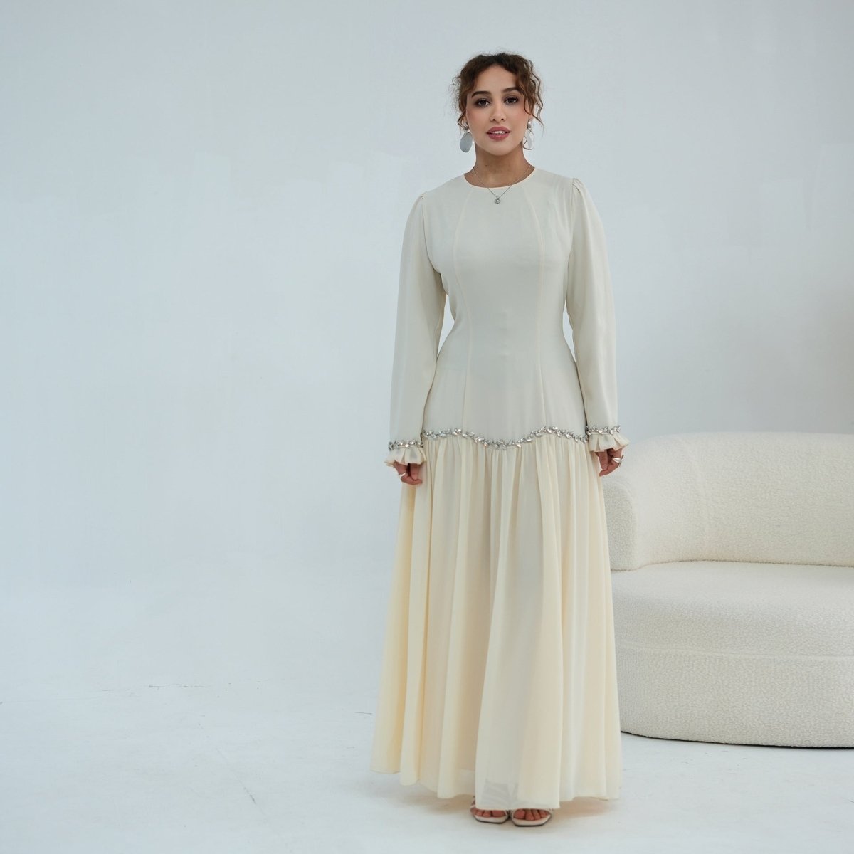 Editorial pose highlighting sculpted bodice fit