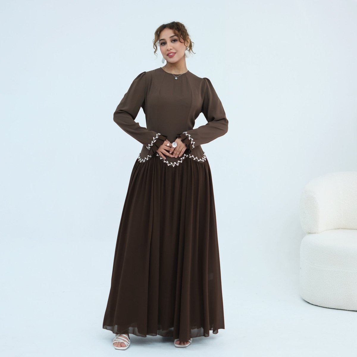 Side profile of structured bodice and flowing skirt