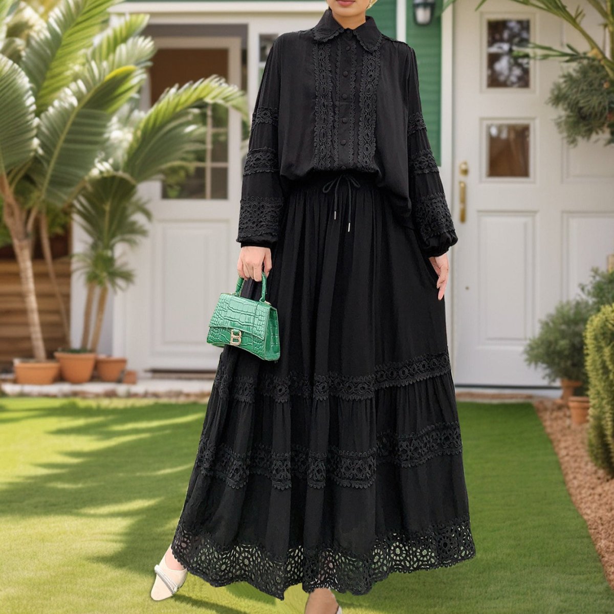 Black cutwork lace blouse and tiered skirt with Victorian detail