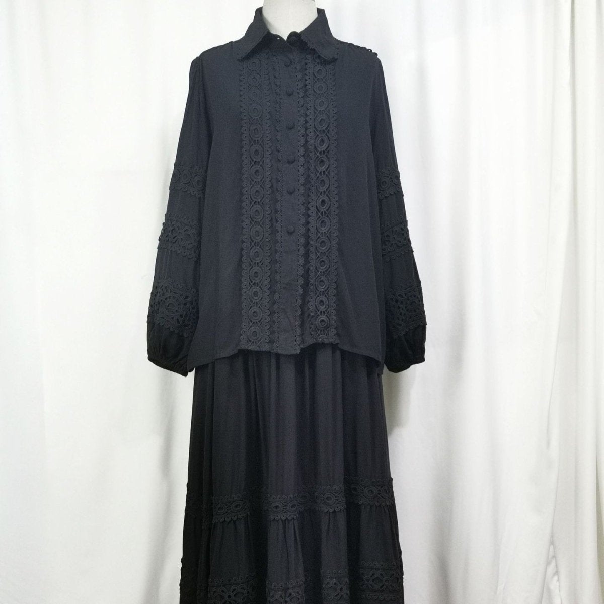 Black tiered maxi skirt set with intricate cutwork lace blouse