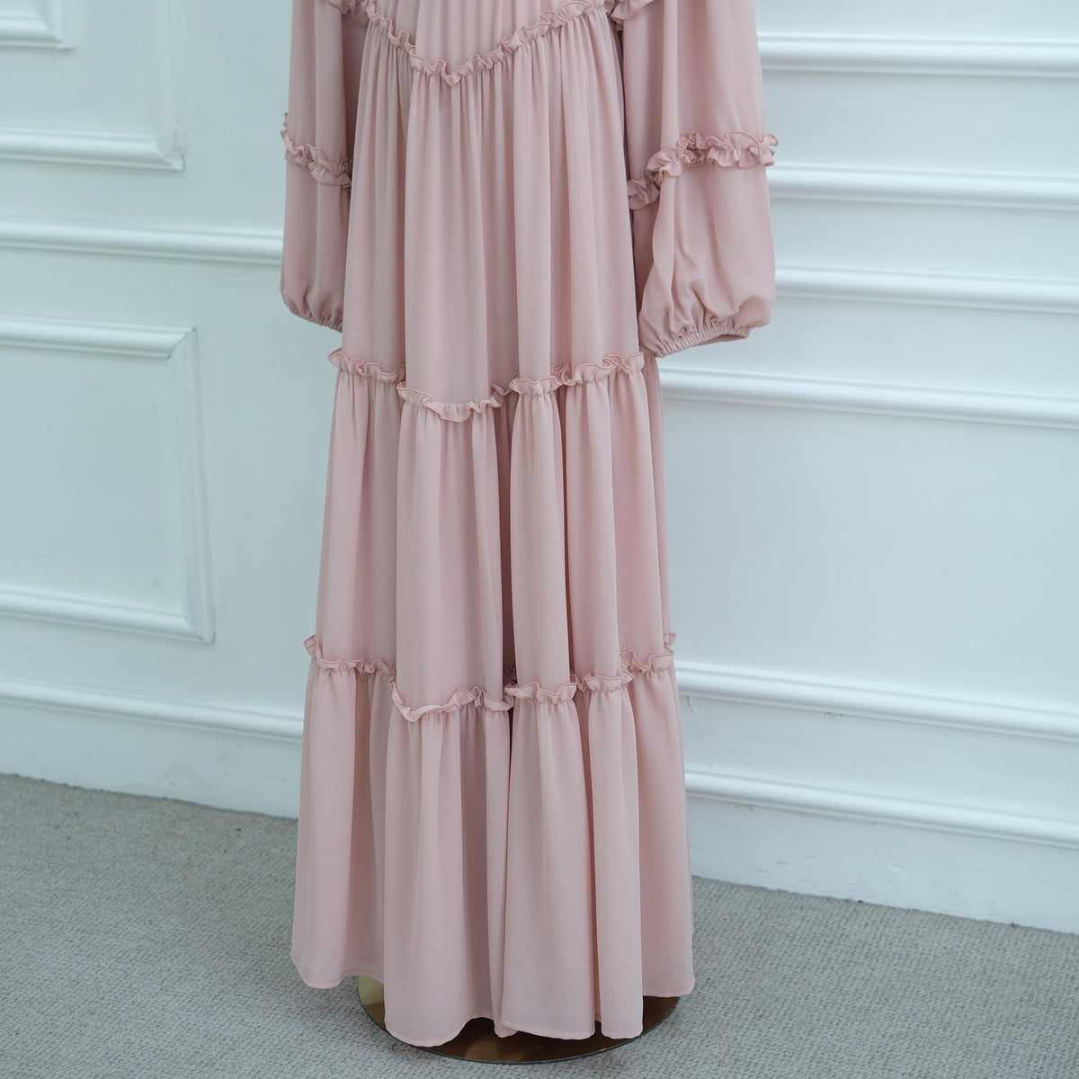 Skirt hem detail showing layered volume and ruffle trim on modest maxi dress