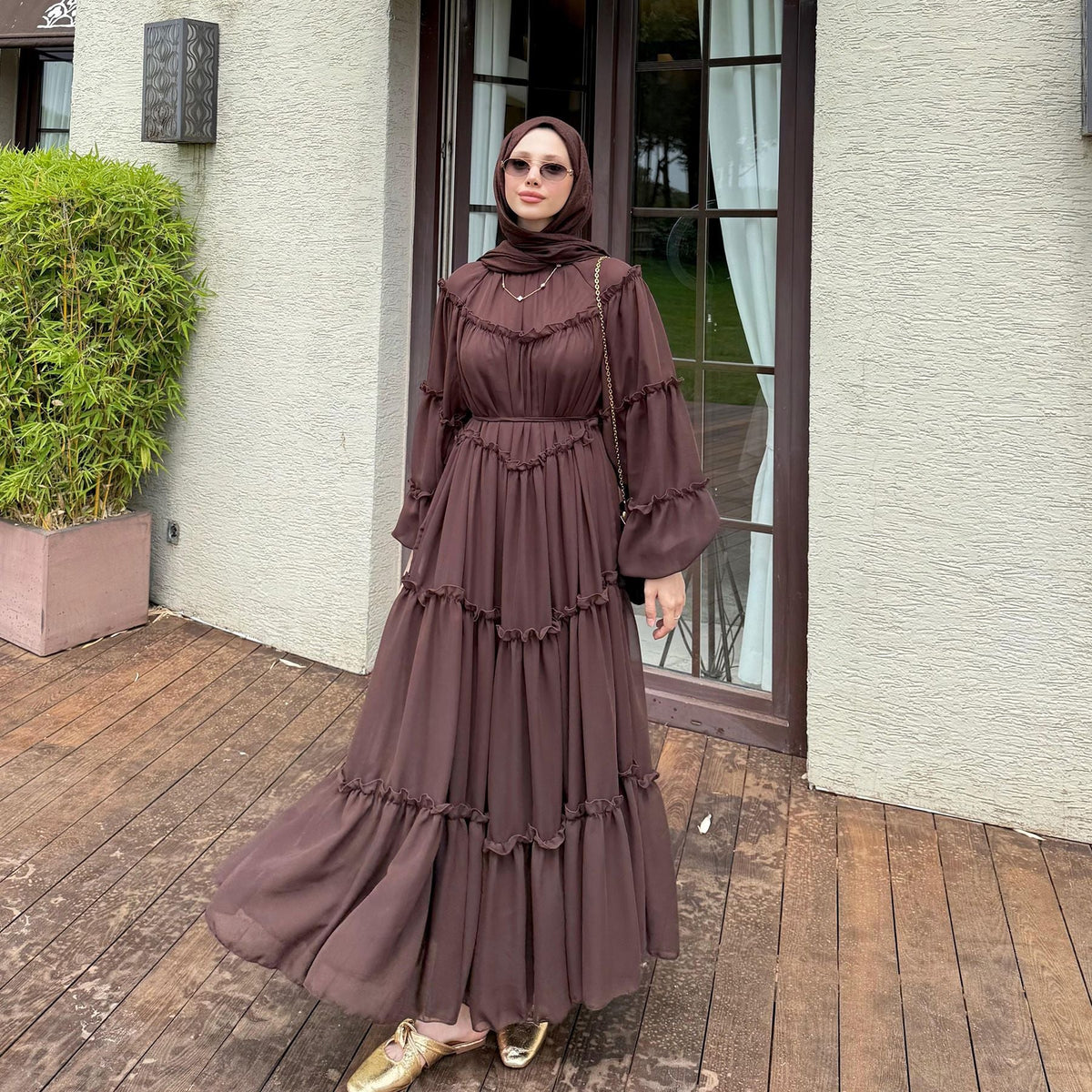 Tiered panel construction detail on layered modest maxi dress skirt
