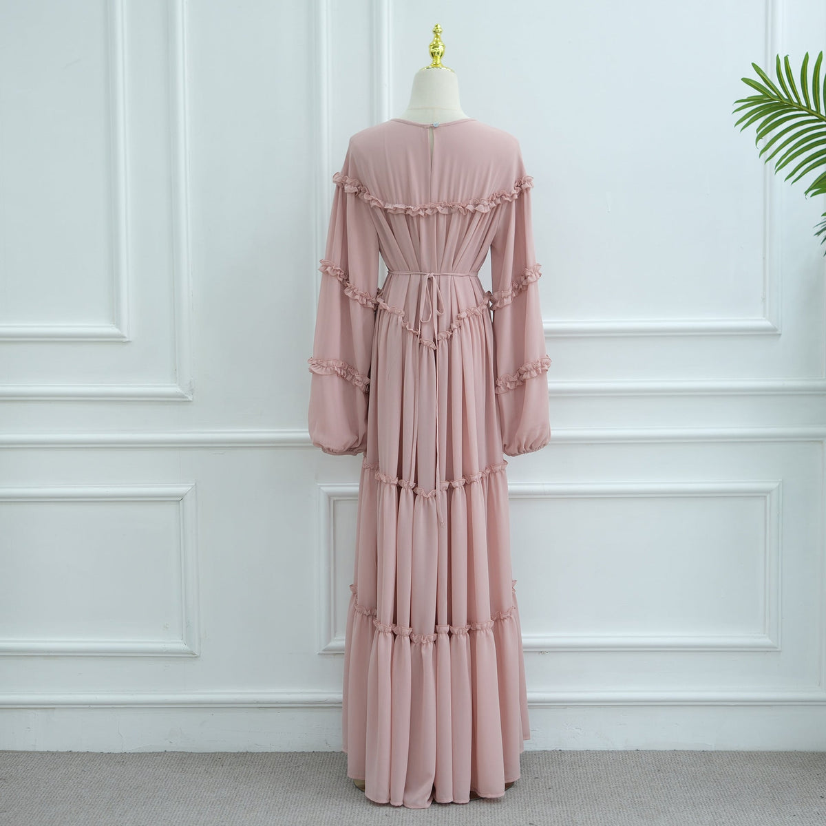 Tiered cake skirt layers in motion on modest ruffle dress