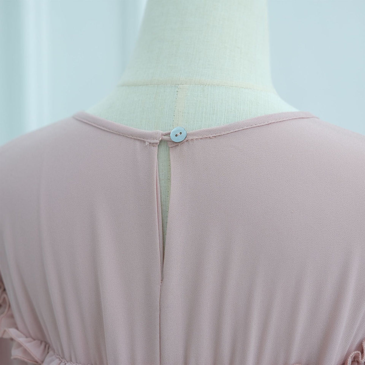 Sleeve ruffle trim detail on full-length tiered modest maxi dress