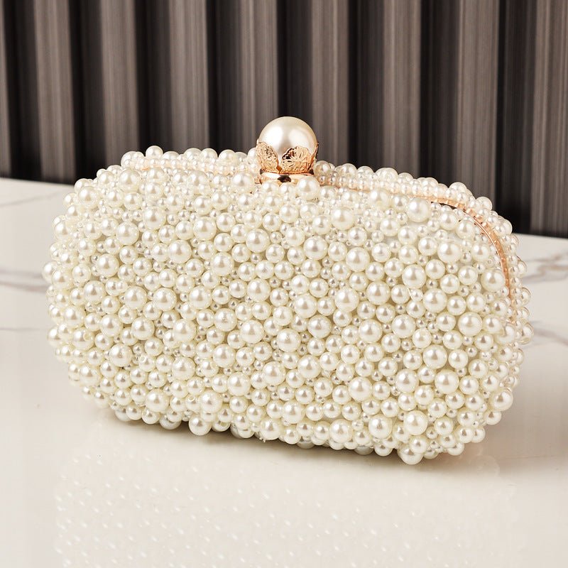 Crossbody strap and top handle options on vintage pearl evening clutch bag