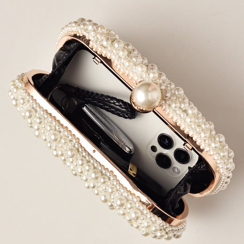 Close-up of dense faux pearl beading and pearl clasp lock on evening clutch