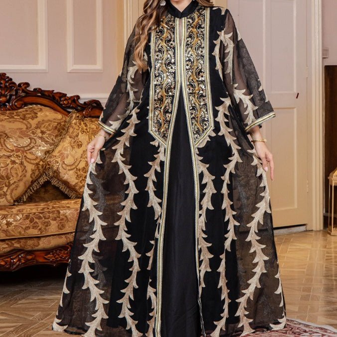Black embroidered mesh abaya with dramatic embellishment and flowing silhouette