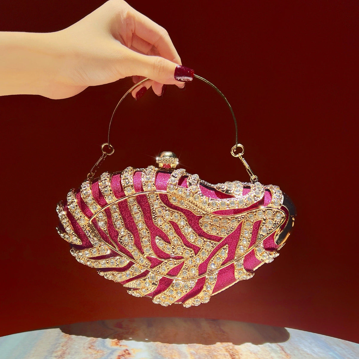 Close-up of sparkling synthetic rhinestone embellishment on the evening clutch bag
