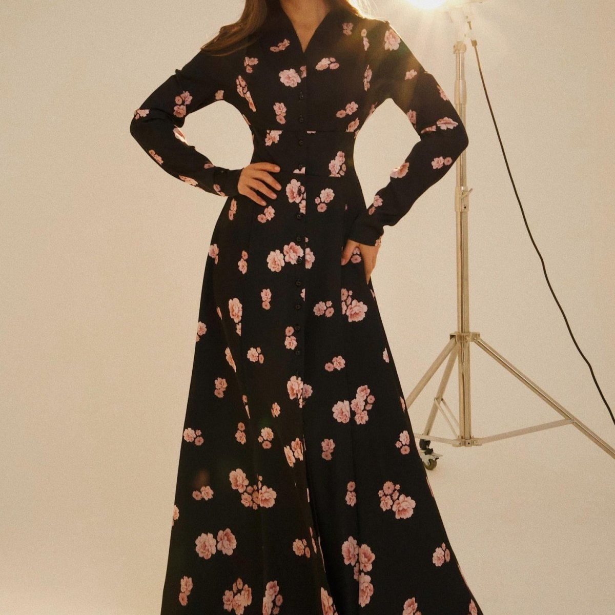 Back view showing self-fabric tie belt and fitted waist